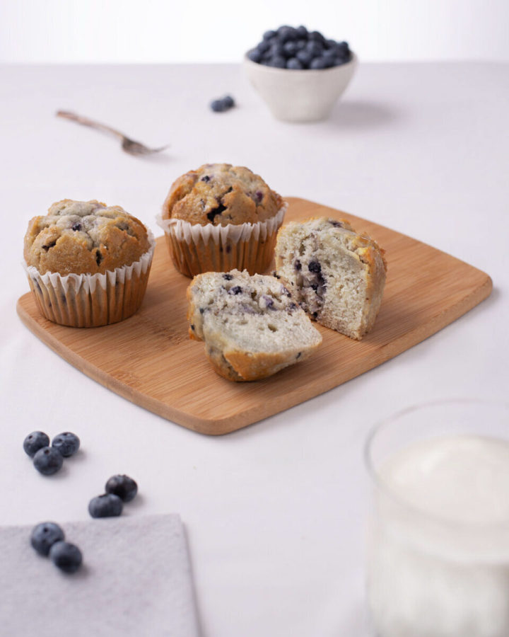 Blueberry Muffins on white table with glass of milk and bowl of Blueberries by Joe Cosentino, Utica New York, Visual Media Strategy