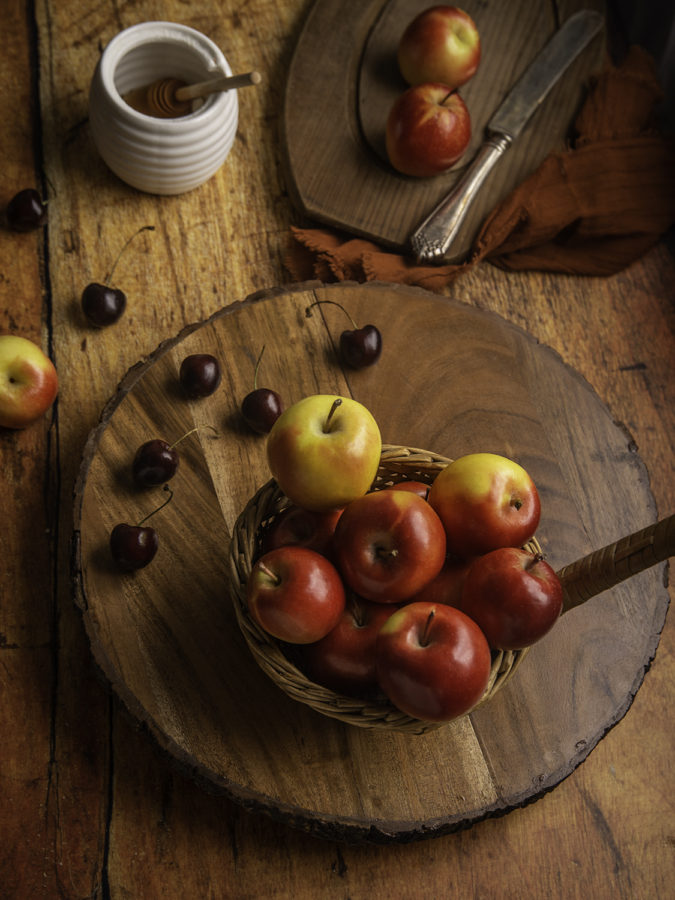 Apples on weathered table by Julie L'Heureux Visual Media Strategy
