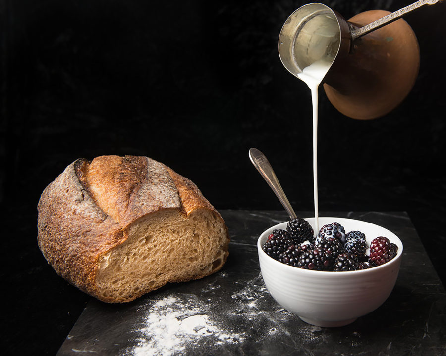 Milk Pour into Bowl of Berries with Loaf of Bread by Julie L'Heureux Visual Media Strategy