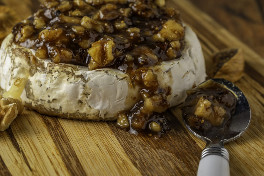 Brie Cheese with Walnuts Close up on Cutting Board by Julie L'Heureux Visual Media Strategy
