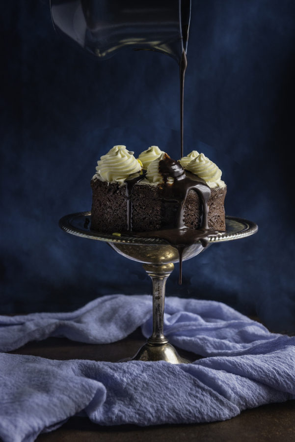 Chocolate Cake on Stand with Chocolate Pour by Julie L'Heureux Visual Media Strategy