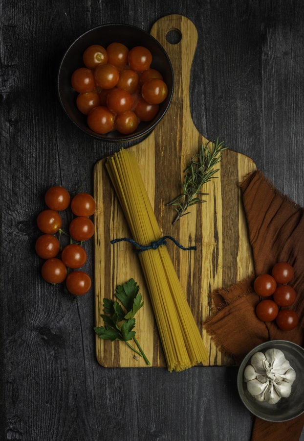 Tomatoes and Pasta on Cutting Board by Julie L'Heureux Visual Media Strategy