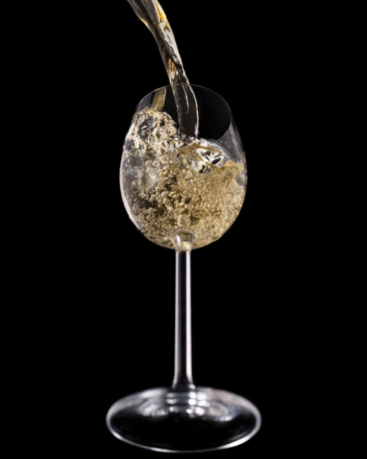 white wine pour angle splash by Teresa Ste-Marie Montreal commercial photographer ; Visual Media Strategy