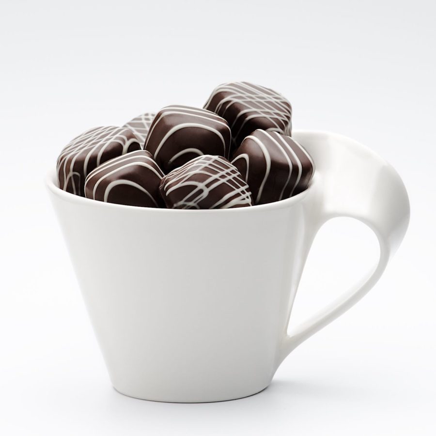 Chocolates in white coffee cup Copyright Bret Doss Visual Media Strategy