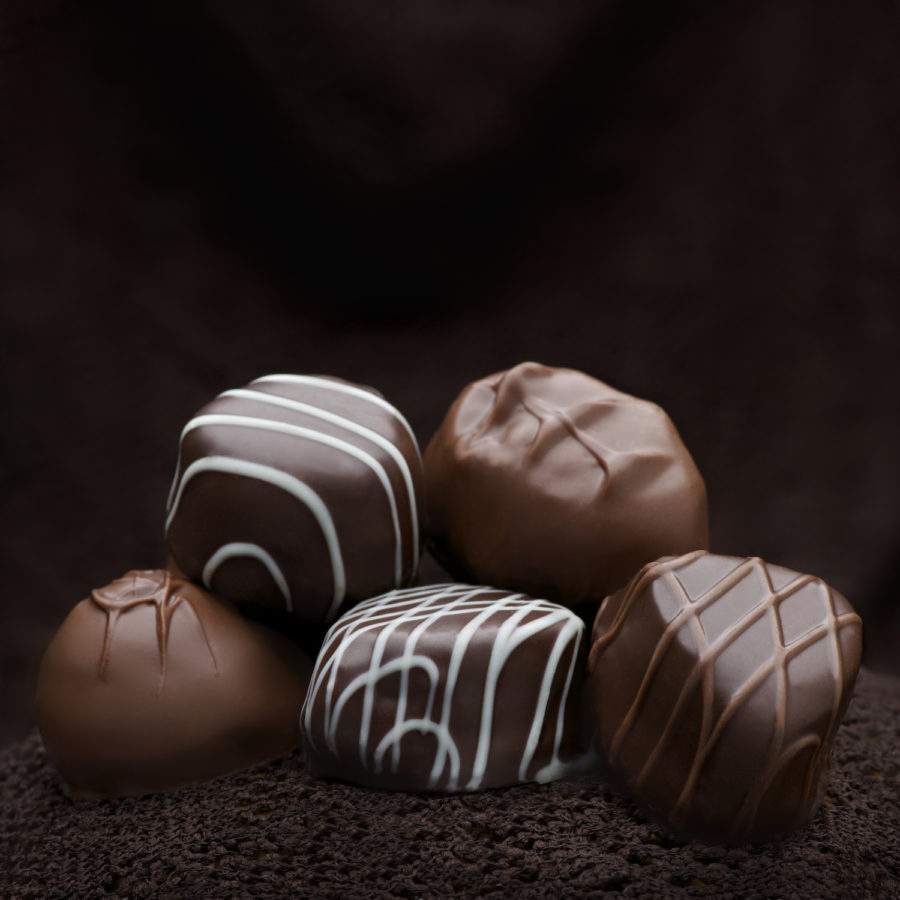 Chocolates on dark brown background Copyright Bret Doss Visual Media Strategy
