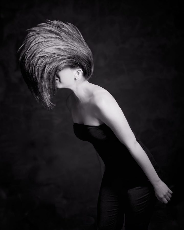 Model Doing Edgy Hair Flip Monochrome Black and White Copyright Bret Doss Visual Media Strategy