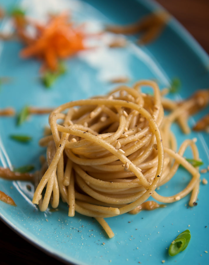 Twisted Plated Pasta on Turquoise Blue Plate Copyright Bret Doss Visual Media Strategy